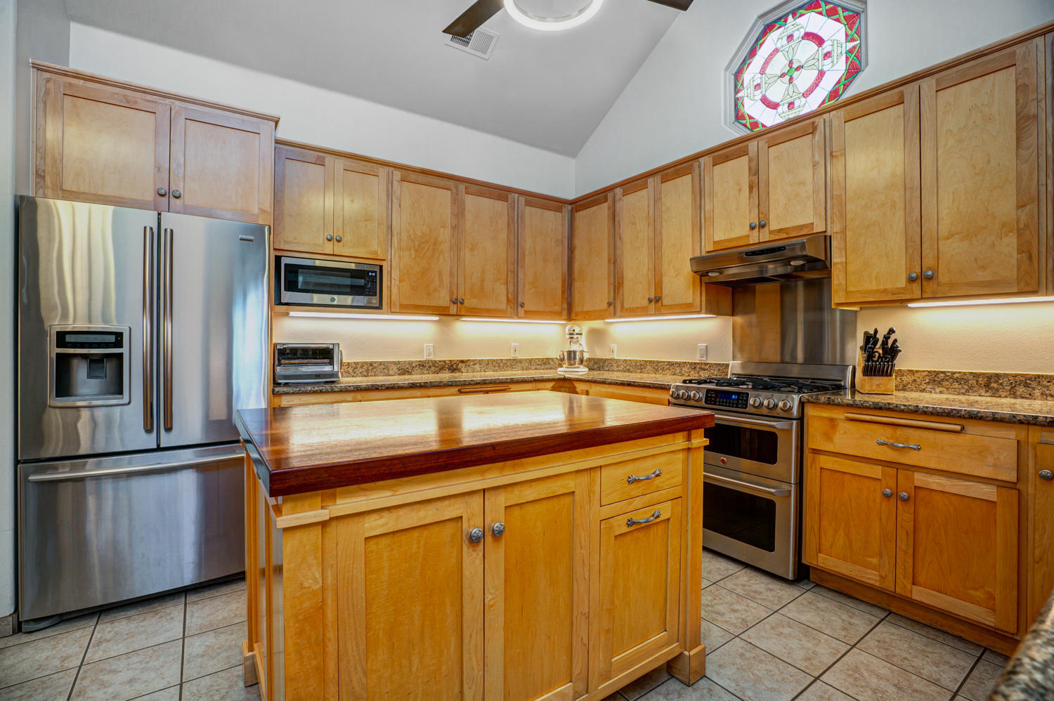179 Baldwin Road Ojai, CA 93023 - Photo 11 of 39 a kitchen with stainless steel appliances granite countertop a refrigerator sink and stove