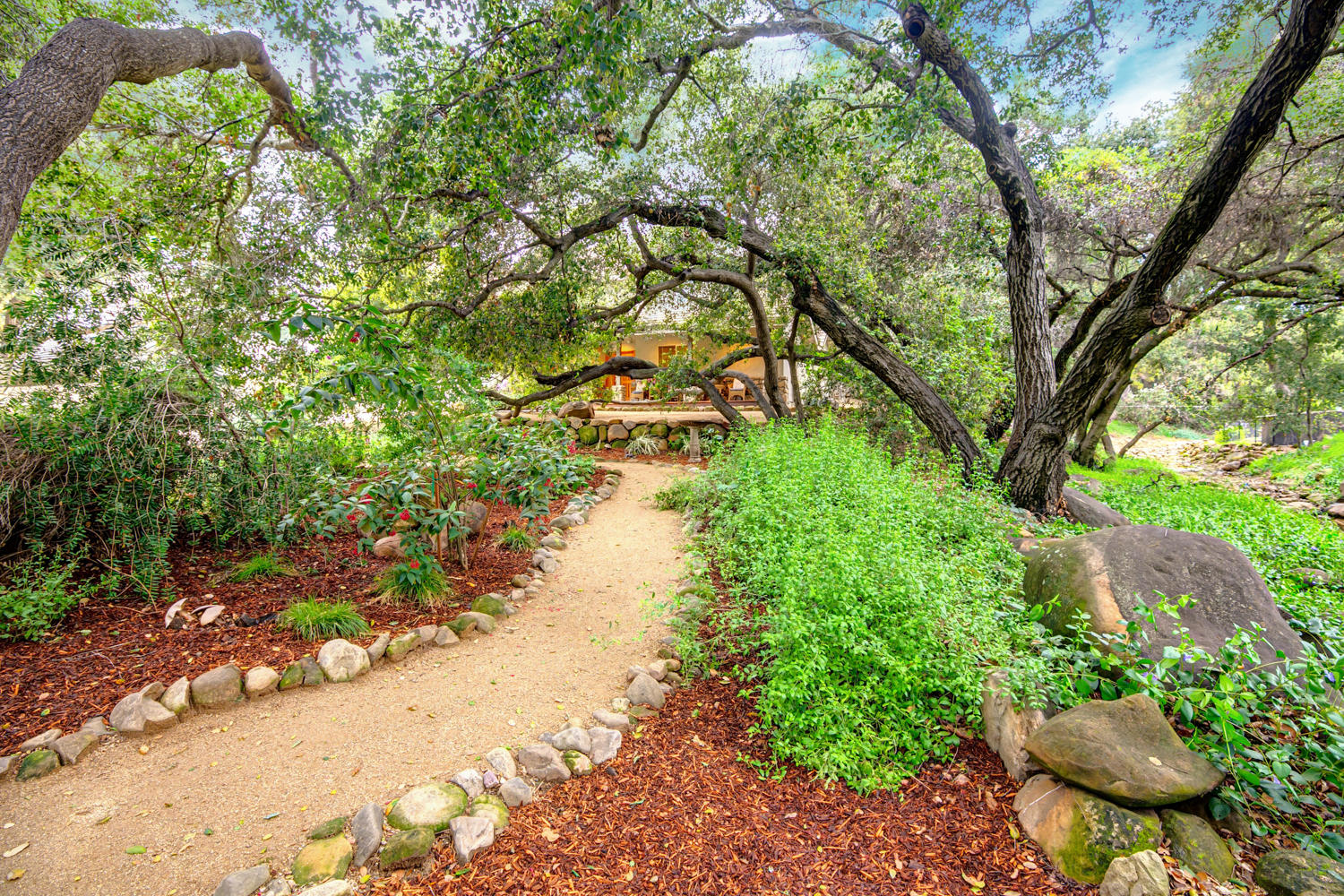 179 Baldwin Road Ojai, CA 93023 - Photo 32 of 39 a backyard of a house with a yard and outdoor seating