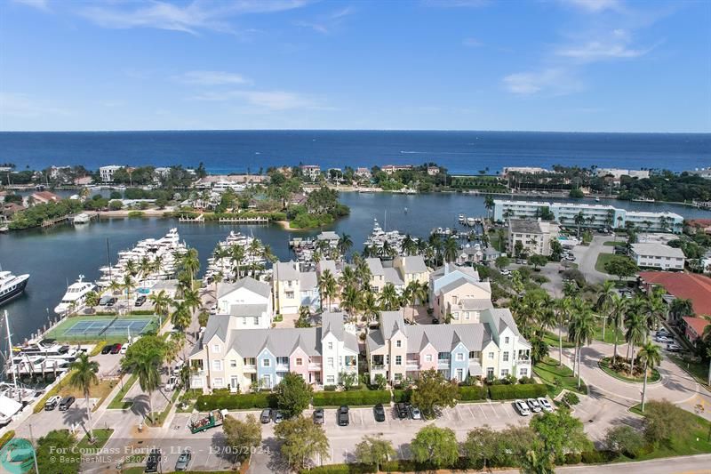2870 Marina Circle Lighthouse Point, FL 33064 - Photo 2 of 37 an aerial view of a city with lots of residential buildings ocean and mountain view in back