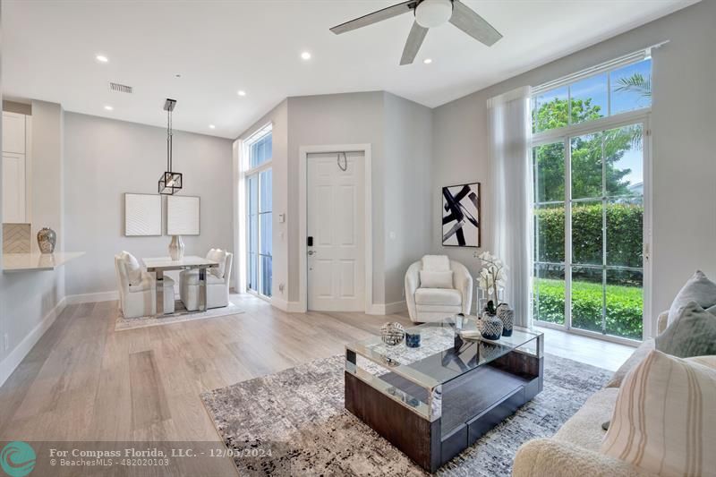 2870 Marina Circle Lighthouse Point, FL 33064 - Photo 6 of 37 a living room with furniture and a large window