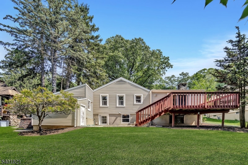 76 Hillside Road Sparta, NJ 07871 - Photo 17 of 18 a view of a house with a yard and deck