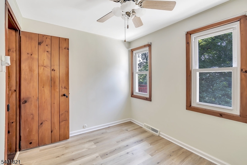 76 Hillside Road Sparta, NJ 07871 - Photo 10 of 18 a view of an entryway with wooden floor and front door