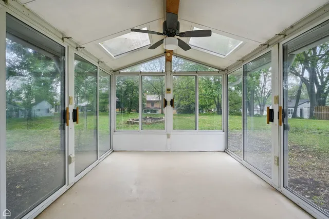a view of a kitchen with a sink and a window