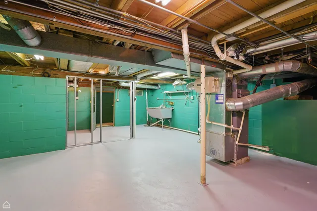 a view of a room with wooden walls and stairs