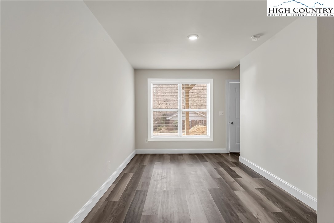 262 Old Bristol Road Boone, NC 28607 - Photo 33 of 38 an empty room with wooden floor and windows
