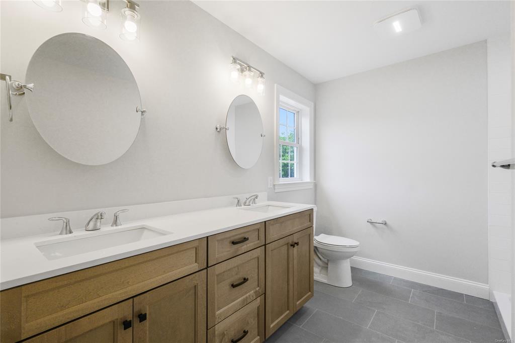 108 Browns Road Walden, NY 12586 - Photo 25 of 36 Primary Bathroom with Tiled Shower and dual sinks