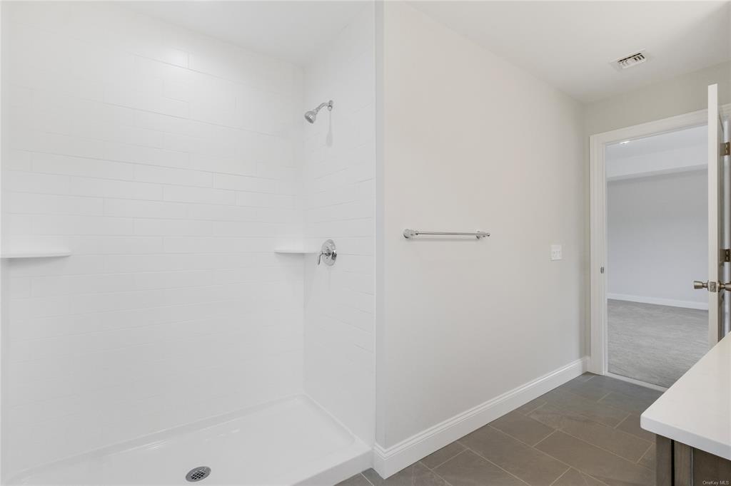 108 Browns Road Walden, NY 12586 - Photo 26 of 36 Bathroom featuring a tile shower and tile patterned flooring