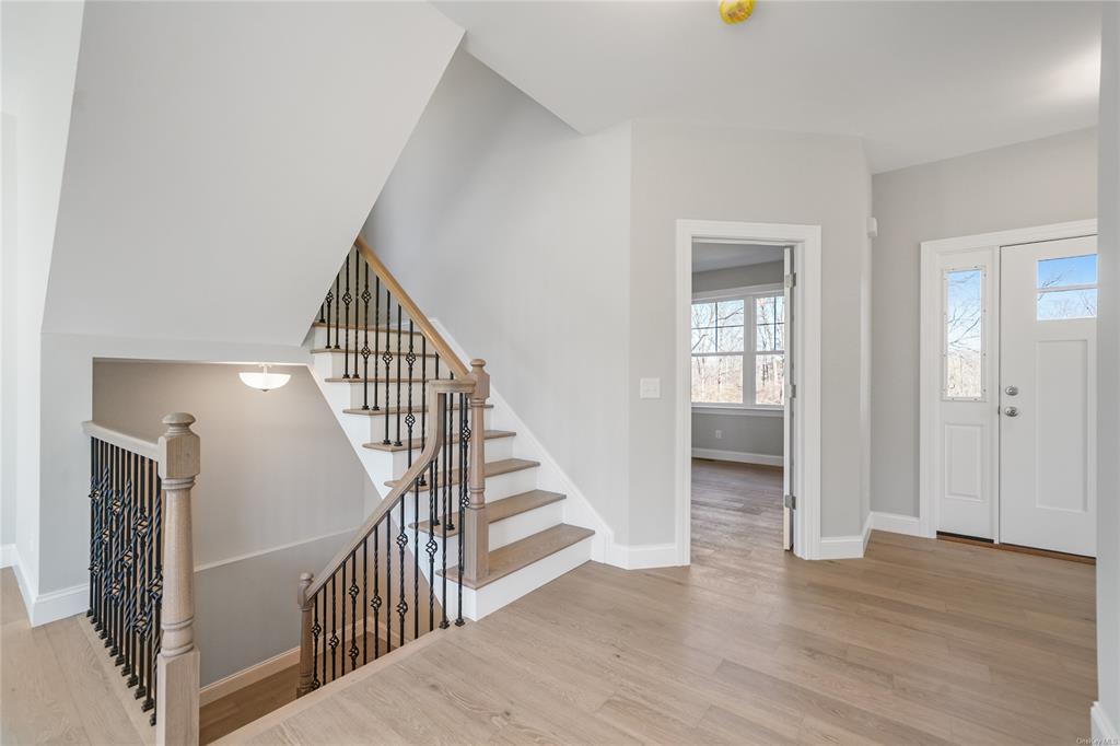 108 Browns Road Walden, NY 12586 - Photo 8 of 36 Open Wrought Iron Stairs leads to 2nd floor and finished basement