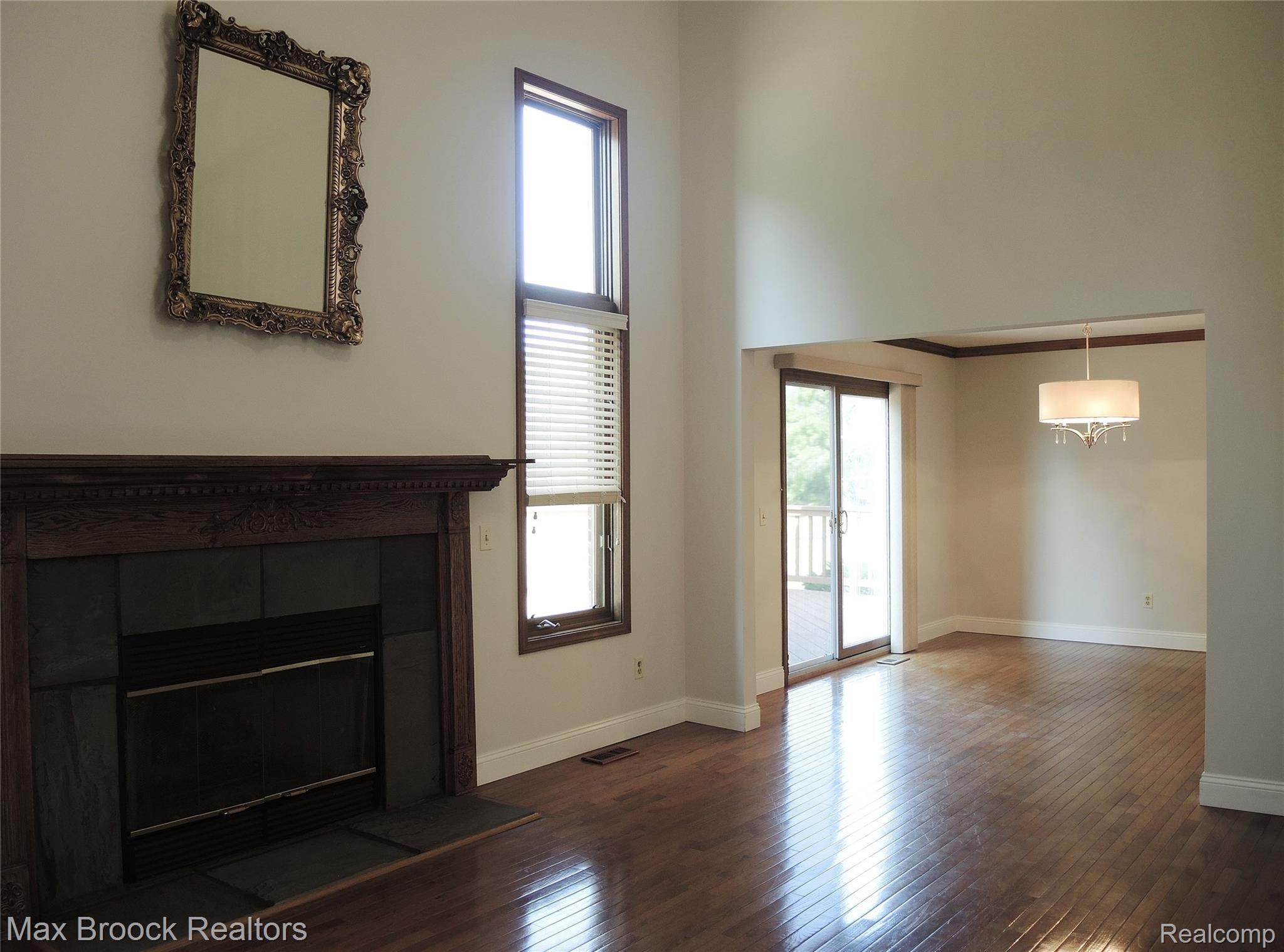 1240 Bembridge Drive Rochester, MI 48307 - Photo 10 of 48 GAS FIREPLACE WITH VIEW OF FORMAL DINING ROOM