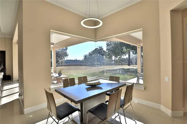 a view of a dining table and chairs in the balcony