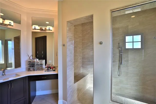 a bathroom with a double vanity sink a mirror and a shower