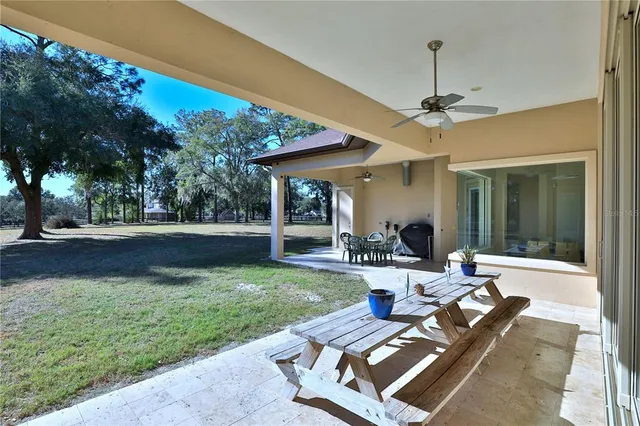 a view of a couches in patio of a yard