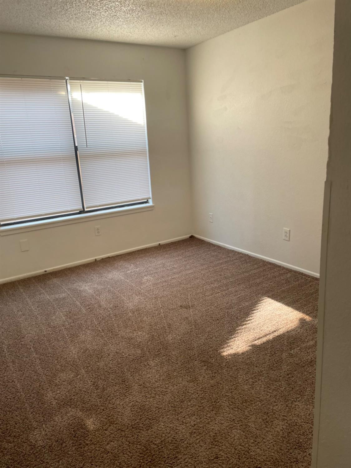 1103 80th Street, Unit A Lubbock, TX 79423 - Photo 9 of 11 a view of an empty room