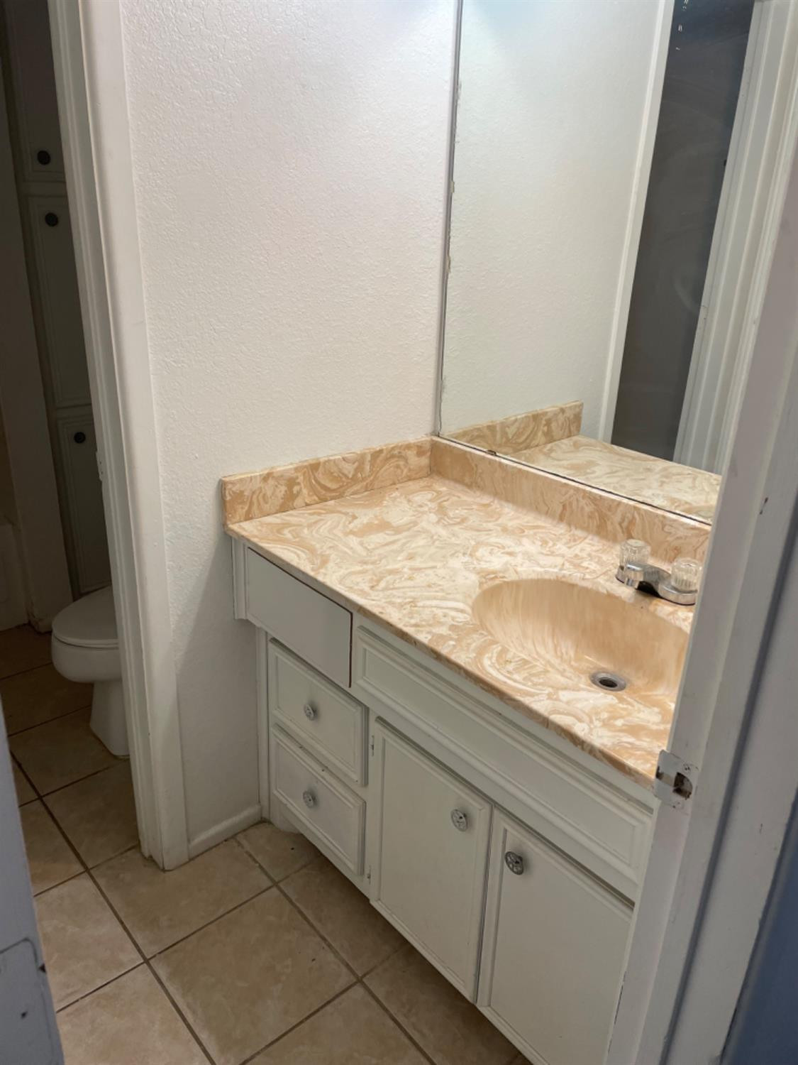 1103 80th Street, Unit A Lubbock, TX 79423 - Photo 10 of 11 a bathroom with a sink and toilet