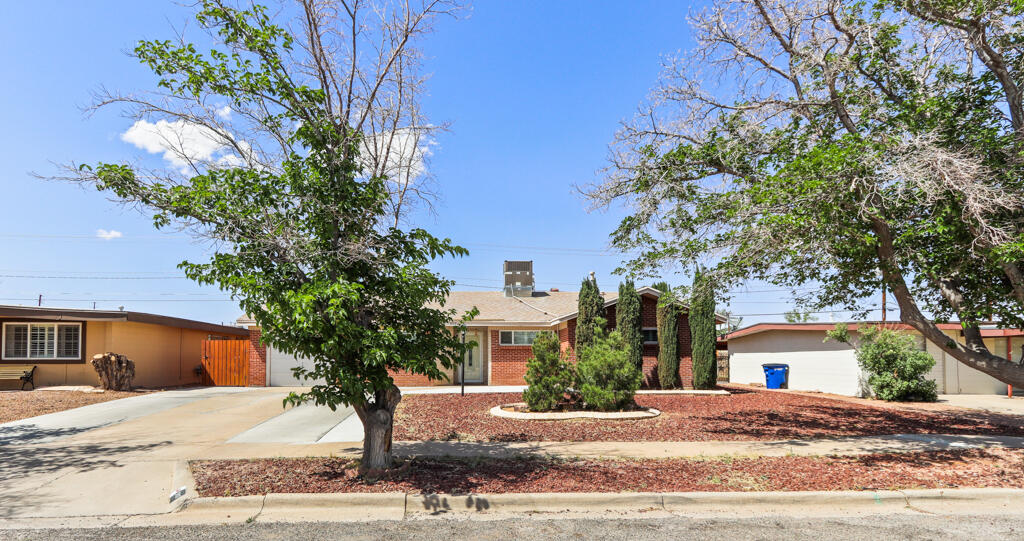 5117 Raintree Avenue El Paso, TX 79924 - Photo 1 of 1 a front view of a house with a yard and garage