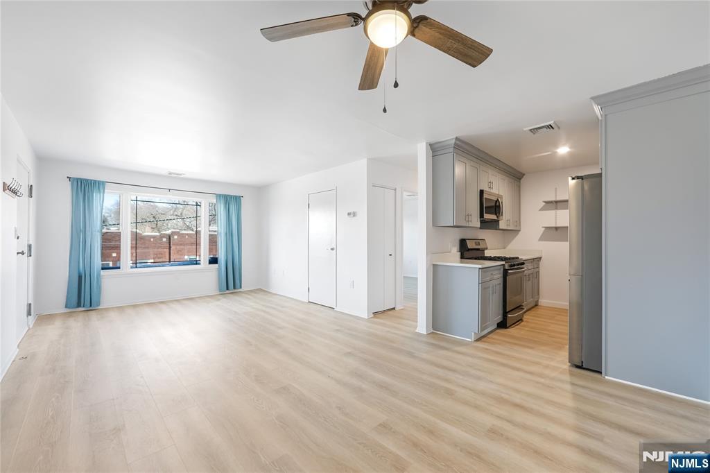 253 Park Avenue, Unit 304 Rutherford, NJ 07070 - Photo 11 of 23 a view of kitchen and hall with wooden floor