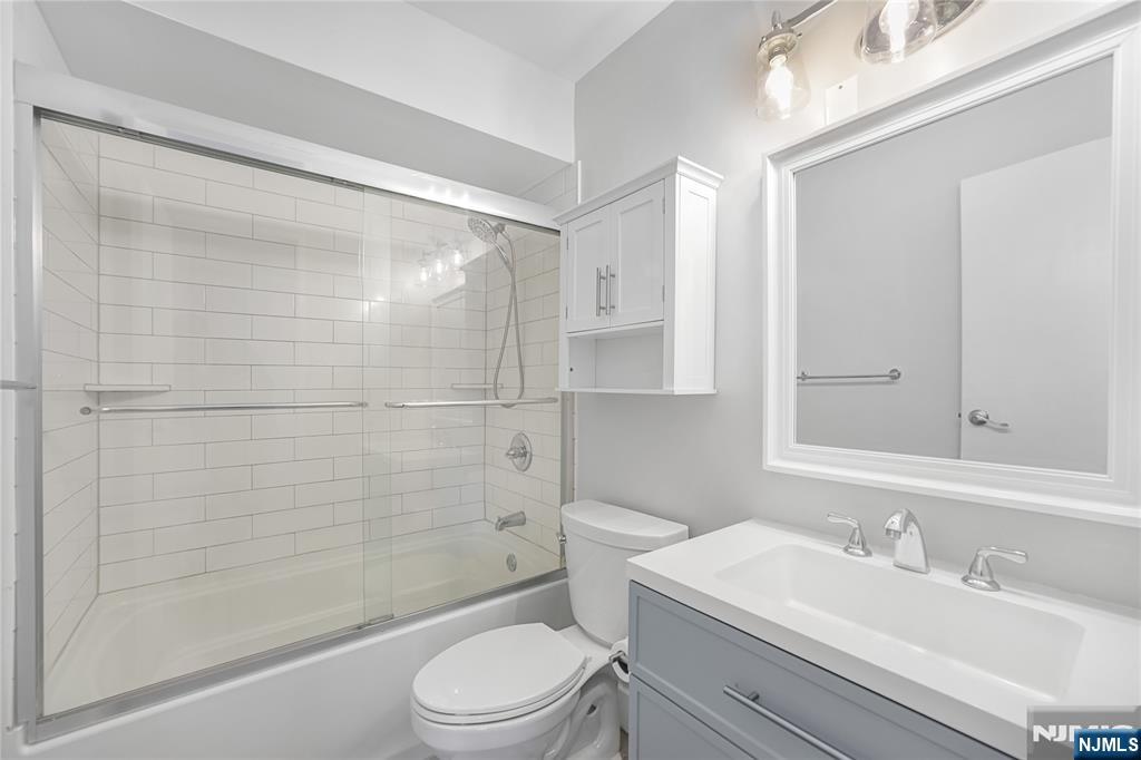 253 Park Avenue, Unit 304 Rutherford, NJ 07070 - Photo 18 of 23 a bathroom with a sink a toilet and shower