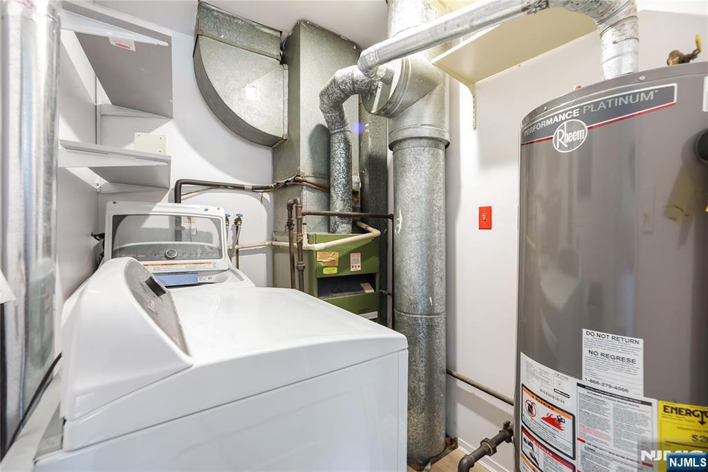 253 Park Avenue, Unit 304 Rutherford, NJ 07070 - Photo 21 of 23 a utility room with dryer and washer