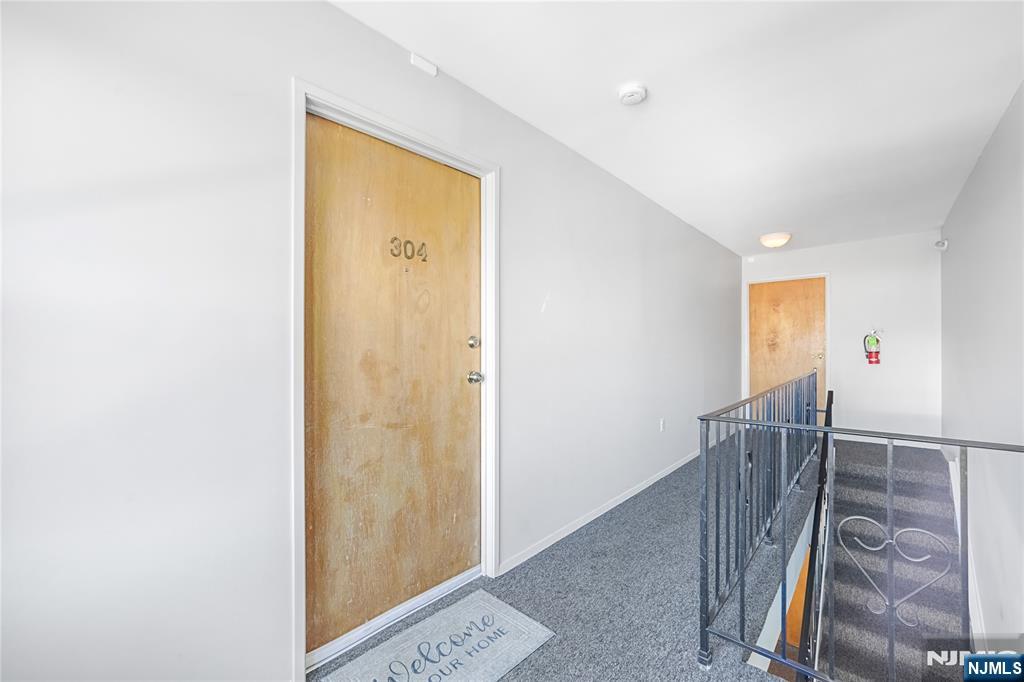 253 Park Avenue, Unit 304 Rutherford, NJ 07070 - Photo 7 of 23 a view of entryway with wooden floor