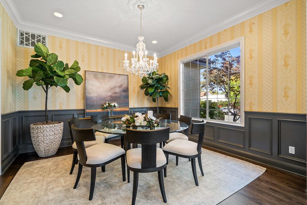 1700 Easton Drive Burlingame, CA 94010 - Photo 18 of 69 a dining room with furniture potted plants and wooden floor
