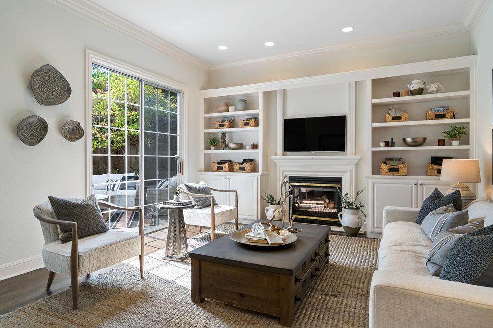 1700 Easton Drive Burlingame, CA 94010 - Photo 23 of 69 a living room with furniture a fireplace and a flat screen tv