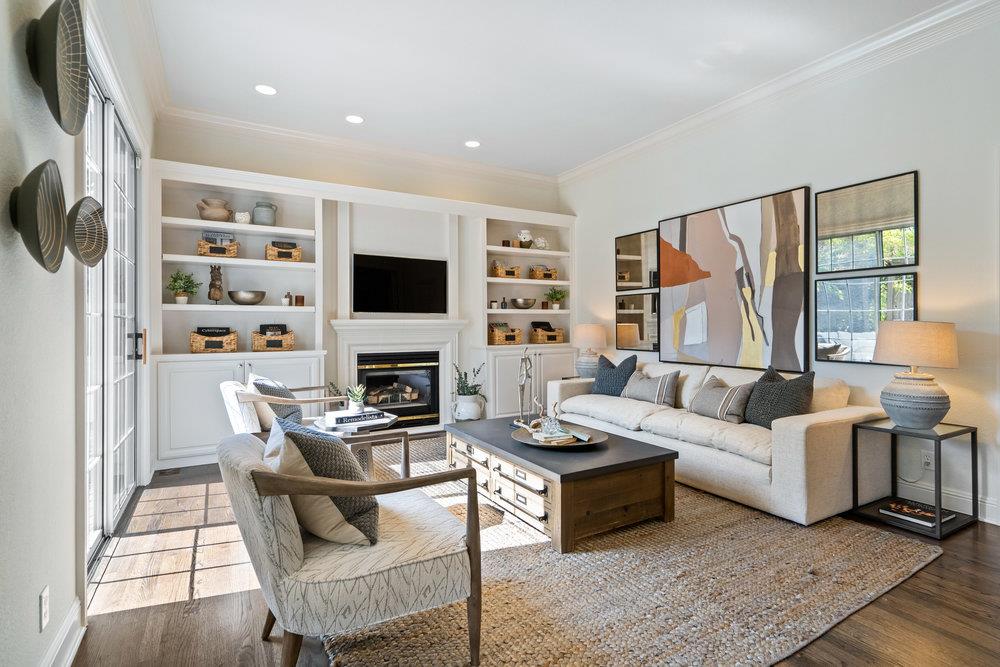 1700 Easton Drive Burlingame, CA 94010 - Photo 25 of 69 a living room with furniture a flat screen tv and a fireplace