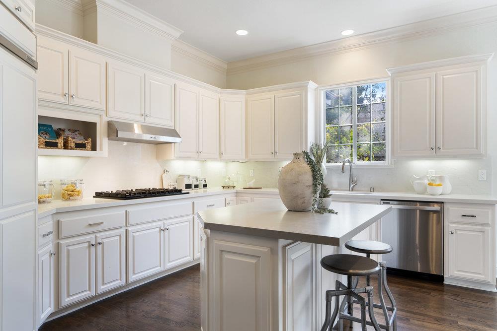 1700 Easton Drive Burlingame, CA 94010 - Photo 26 of 69 a kitchen with stainless steel appliances granite countertop a sink and cabinets