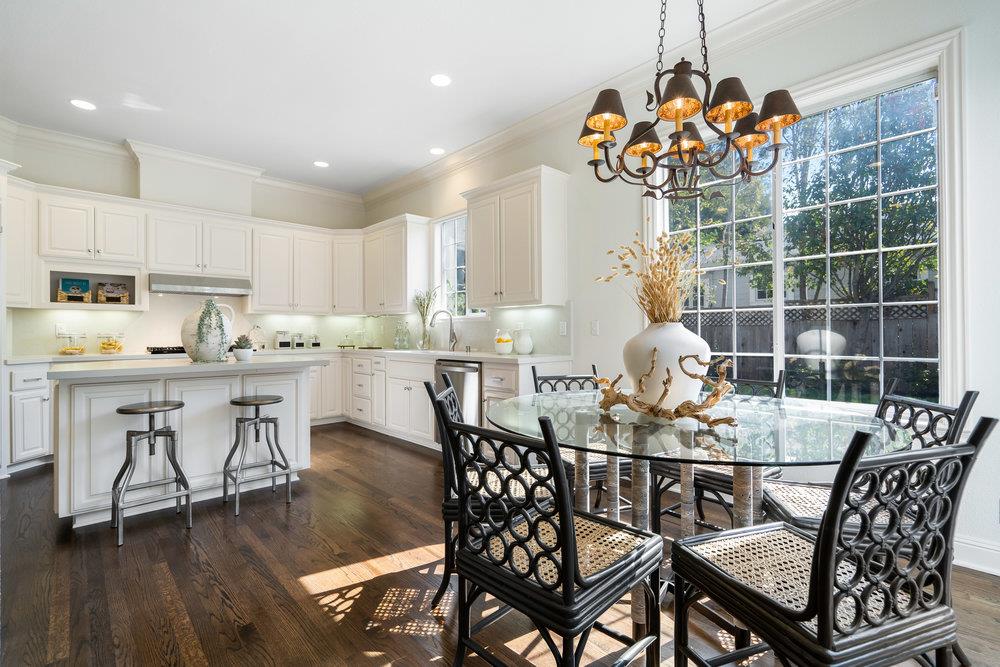 1700 Easton Drive Burlingame, CA 94010 - Photo 32 of 69 a dining room filled chandelier and wooden floor