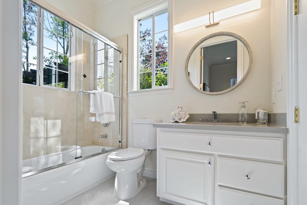 1700 Easton Drive Burlingame, CA 94010 - Photo 36 of 69 a bathroom with a toilet a sink a mirror a window and vanity