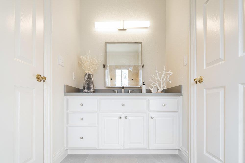 1700 Easton Drive Burlingame, CA 94010 - Photo 45 of 69 a bathroom with a sink and a mirror