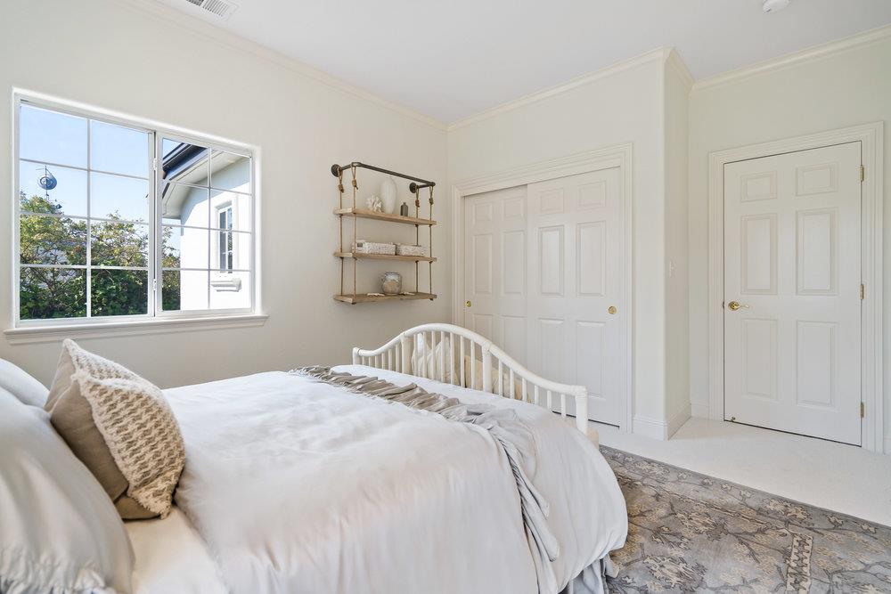 1700 Easton Drive Burlingame, CA 94010 - Photo 47 of 69 a bedroom with a bed and a window