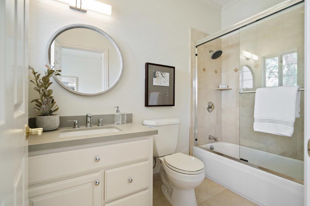 1700 Easton Drive Burlingame, CA 94010 - Photo 51 of 69 a bathroom with a toilet a sink a mirror a bathtub and shower