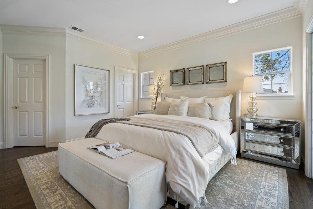 1700 Easton Drive Burlingame, CA 94010 - Photo 53 of 69 a bedroom with a bed and a painting on the wall