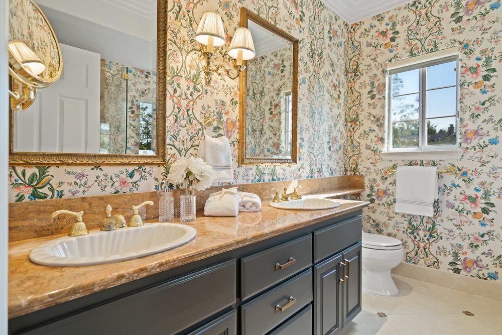 1700 Easton Drive Burlingame, CA 94010 - Photo 56 of 69 a bathroom with a granite countertop sink and a mirror