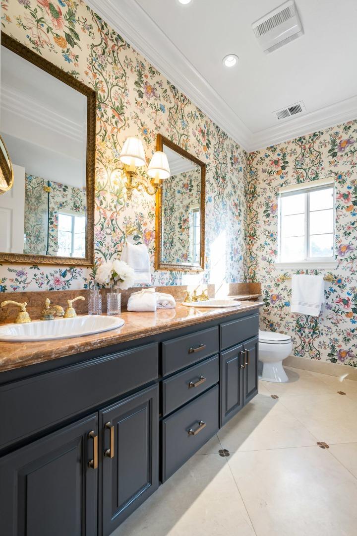 1700 Easton Drive Burlingame, CA 94010 - Photo 58 of 69 a bathroom with double vanity sinks a large mirror and a bathtub