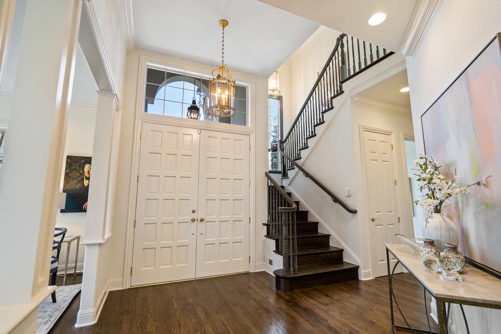 1700 Easton Drive Burlingame, CA 94010 - Photo 10 of 69 a view of a livingroom with wooden floor and stairs