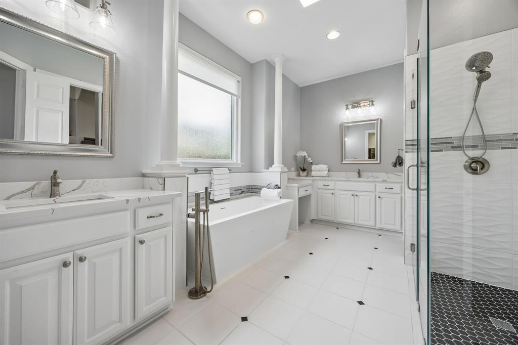 1011 Three Rivers Drive Prosper, TX 75078 - Photo 11 of 27 a bathroom with a sink double vanity granite tub shower and a mirror