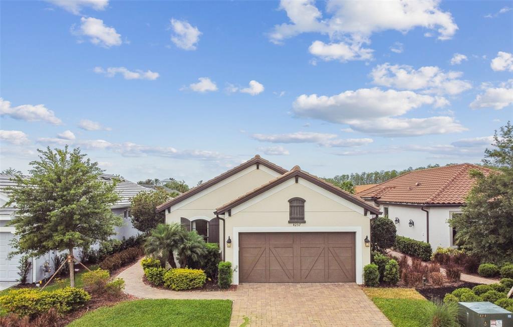 4257 Rosatti Road Wesley Chapel, FL 33543 - Photo 1 of 96 a view of a house with a small yard plants and large tree