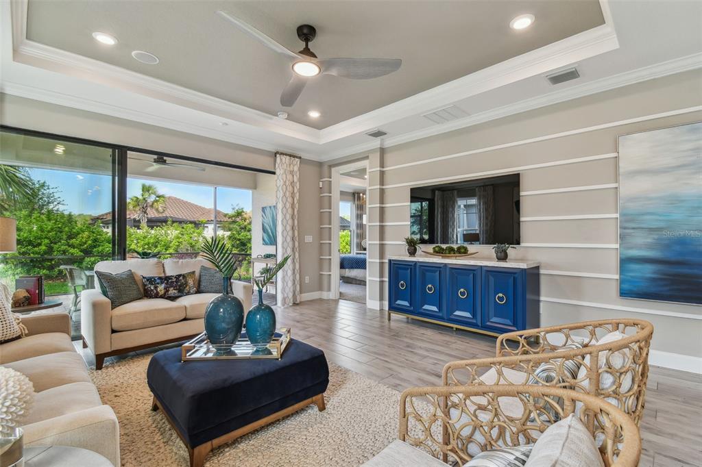 4257 Rosatti Road Wesley Chapel, FL 33543 - Photo 26 of 96 a living room with furniture and a large window