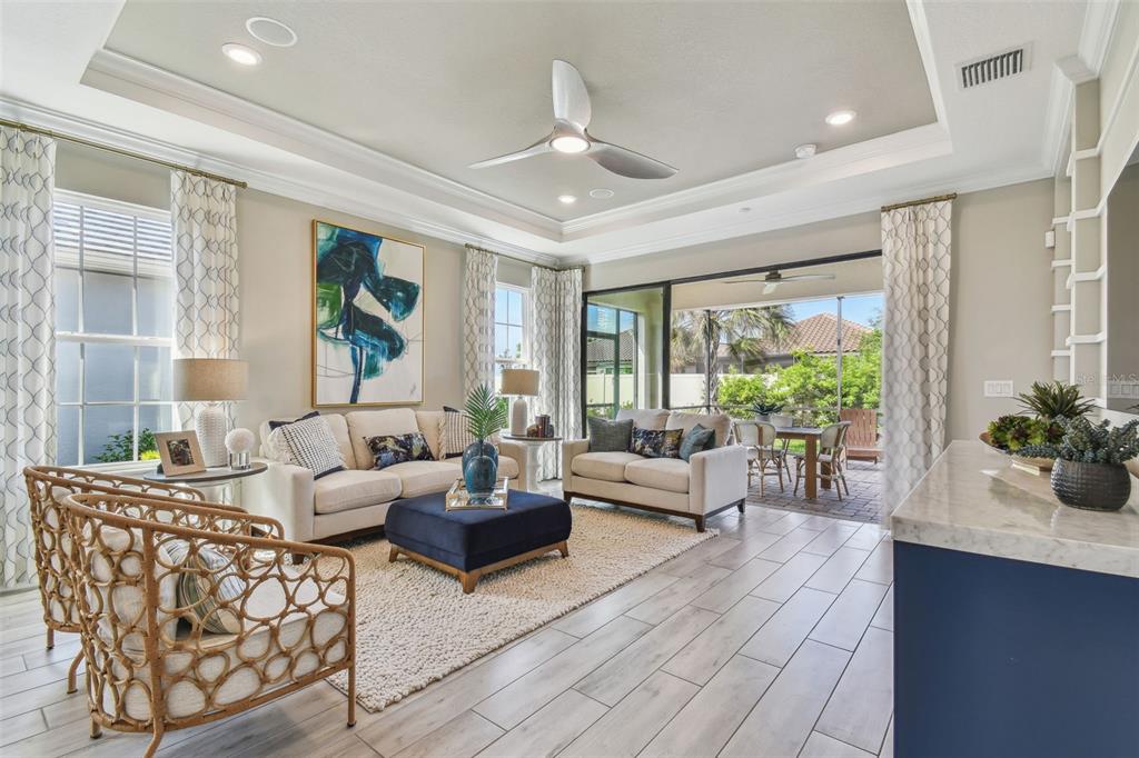 4257 Rosatti Road Wesley Chapel, FL 33543 - Photo 27 of 96 a living room with furniture and a large window