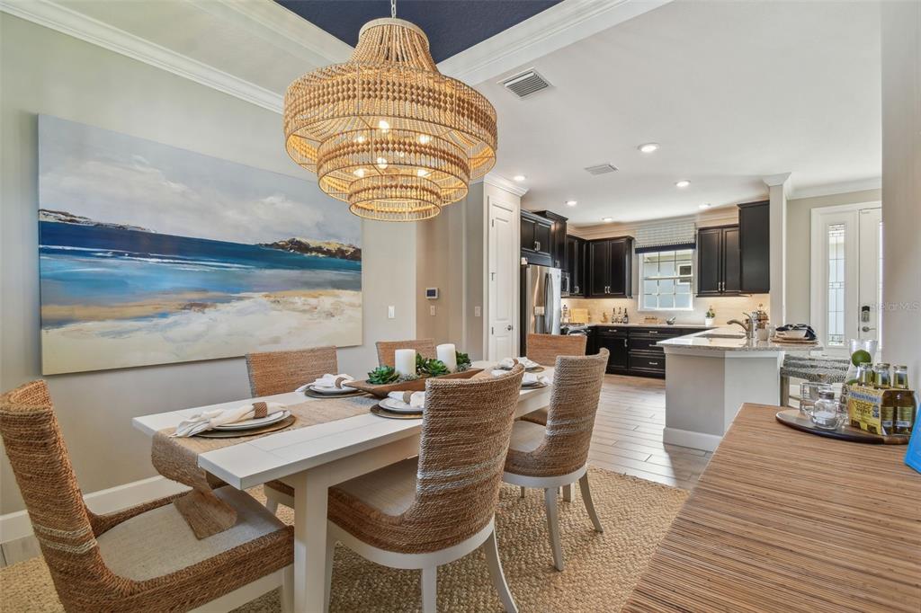 4257 Rosatti Road Wesley Chapel, FL 33543 - Photo 32 of 96 a view of a dining room with furniture window and wooden floor