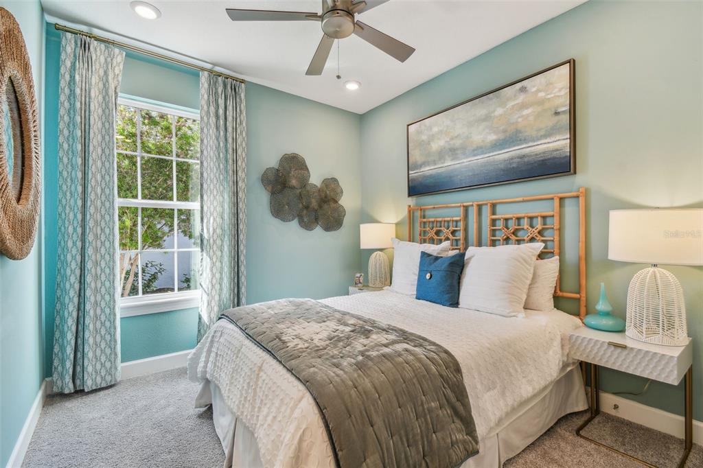 4257 Rosatti Road Wesley Chapel, FL 33543 - Photo 34 of 96 a bedroom with a large bed and a window