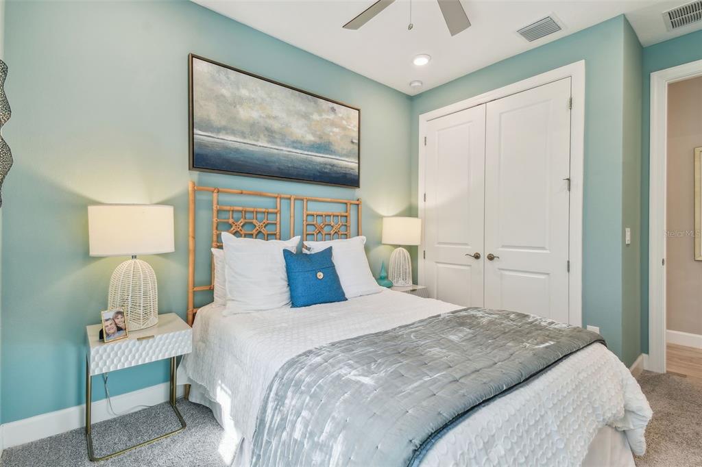 4257 Rosatti Road Wesley Chapel, FL 33543 - Photo 35 of 96 a bedroom with a bed and a painting on the wall