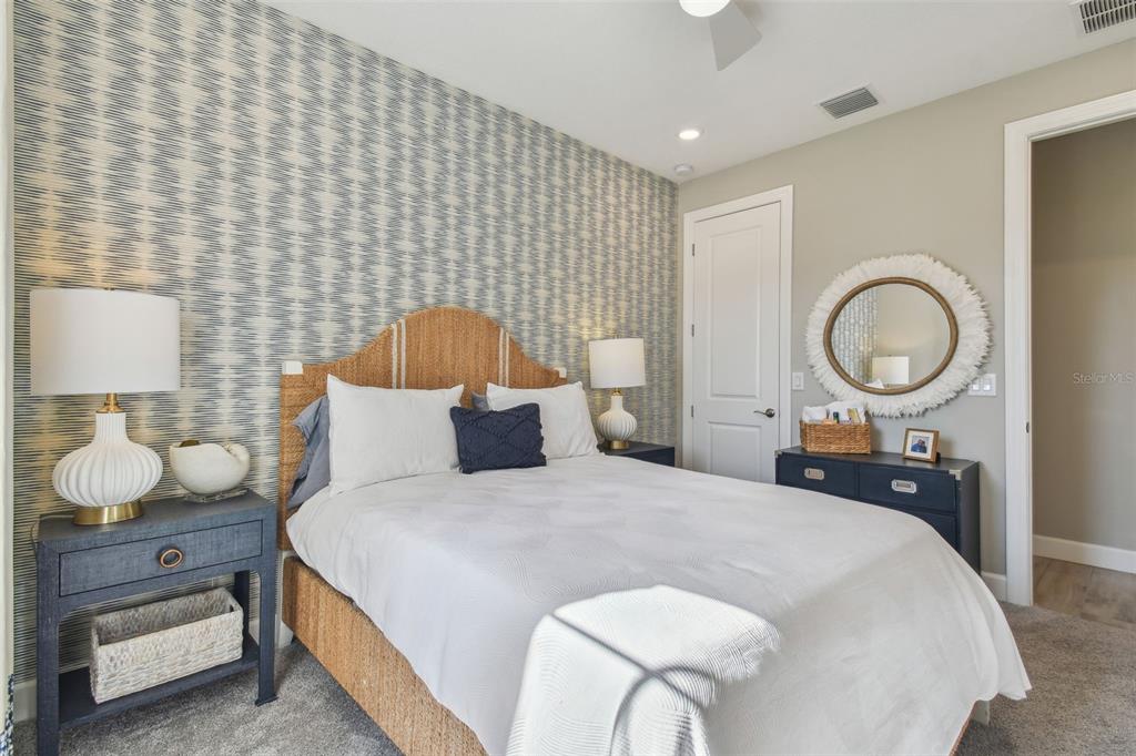 4257 Rosatti Road Wesley Chapel, FL 33543 - Photo 44 of 96 a bedroom with a bed and a lamp