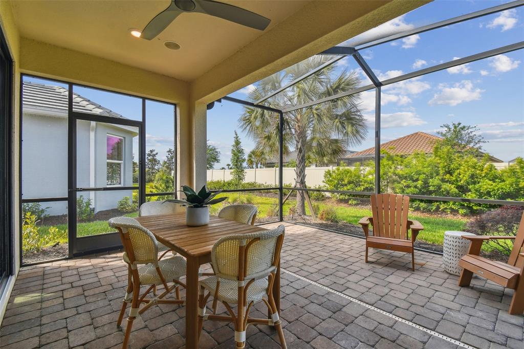 4257 Rosatti Road Wesley Chapel, FL 33543 - Photo 48 of 96 a dining room with furniture and a garden