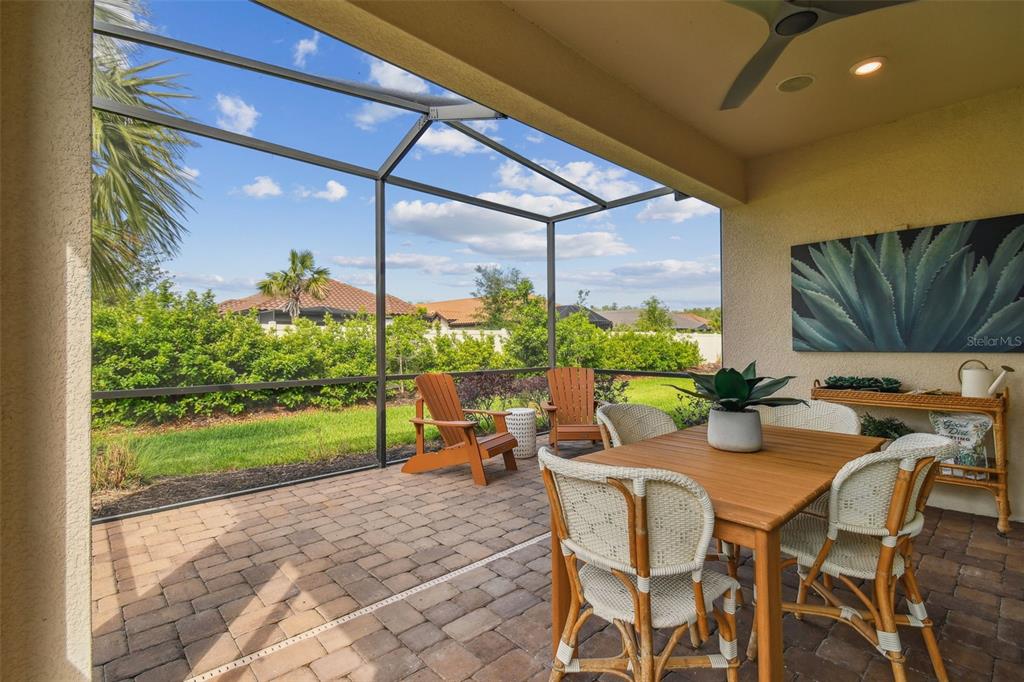 4257 Rosatti Road Wesley Chapel, FL 33543 - Photo 49 of 96 a view of an outdoor dining space with furniture and garden
