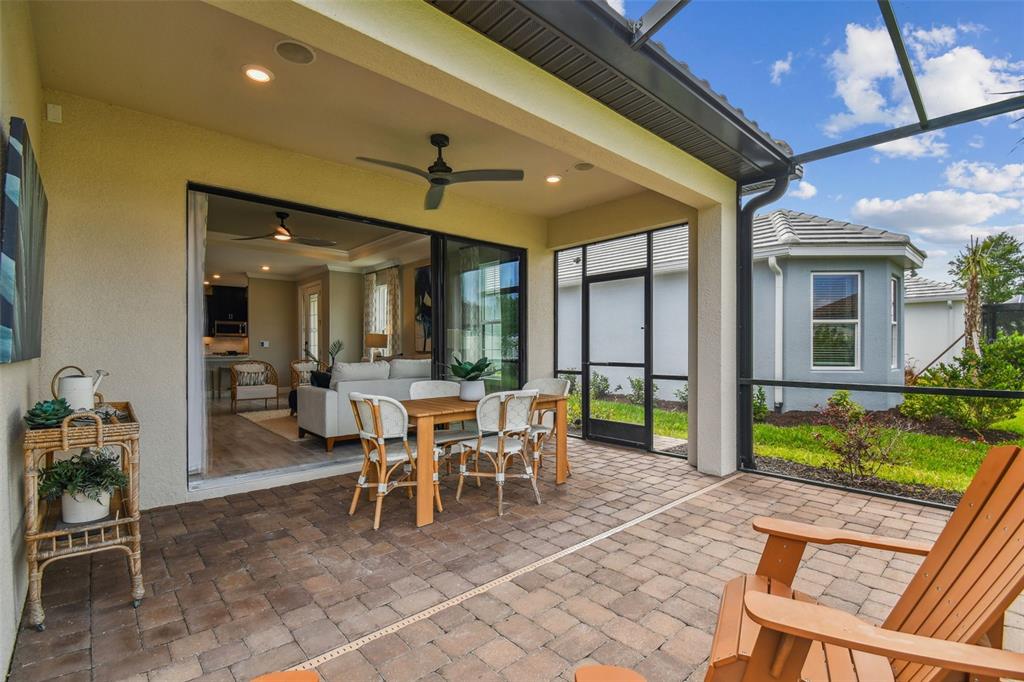 4257 Rosatti Road Wesley Chapel, FL 33543 - Photo 61 of 96 a dining space with furniture and a garden