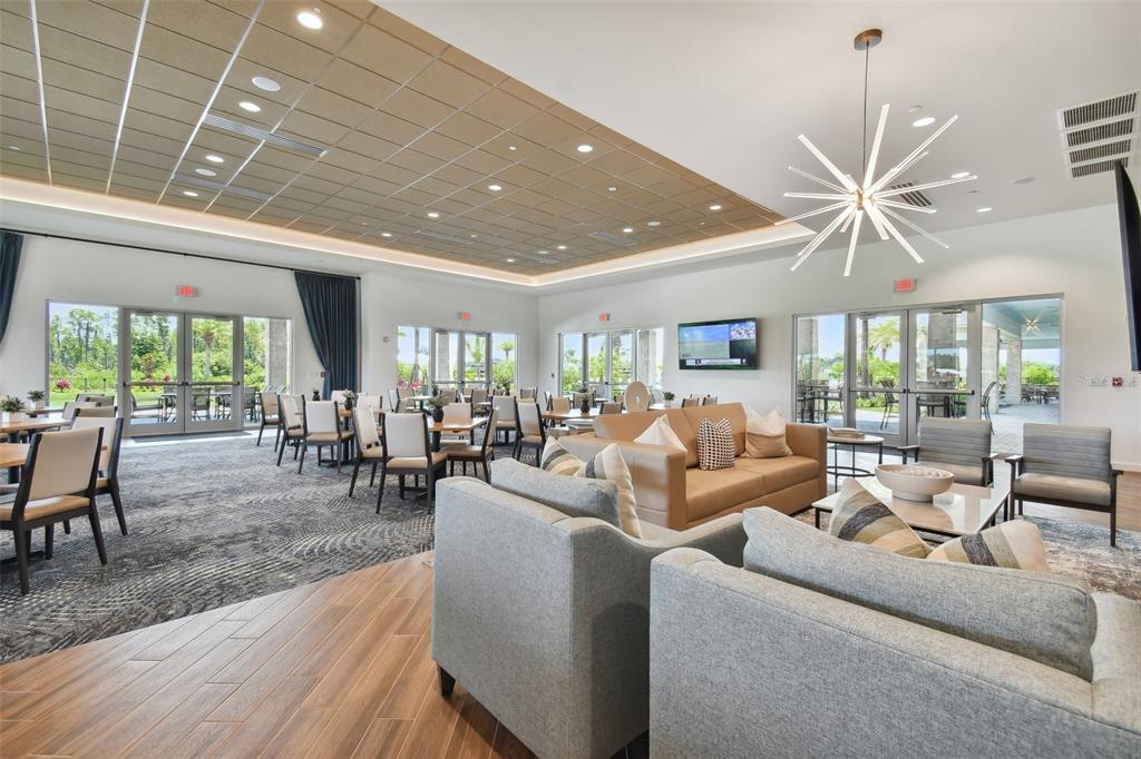 4257 Rosatti Road Wesley Chapel, FL 33543 - Photo 82 of 96 a living room with furniture and a large window with wooden floor