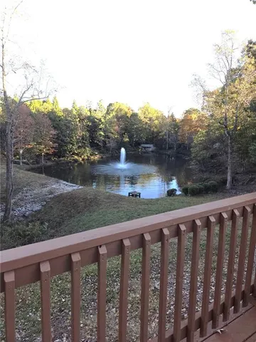 a balcony with trees in front of it