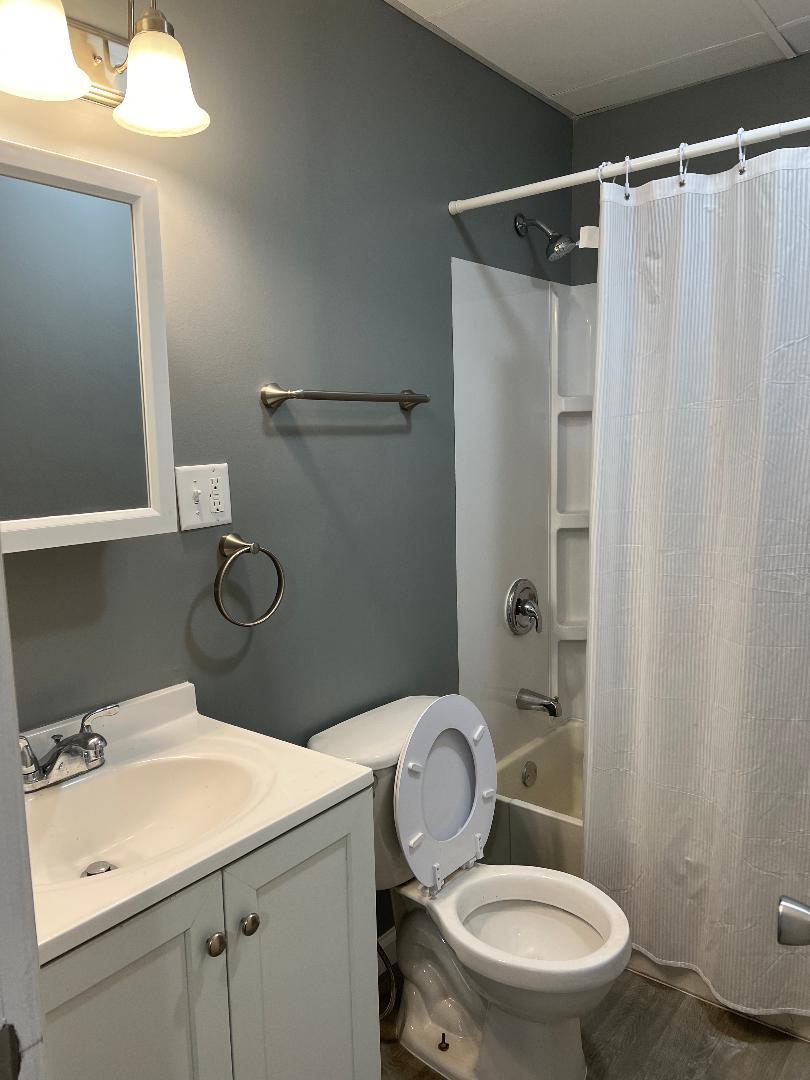 343 South Harrison Avenue, Unit 343 Kankakee, IL 60901 - Photo 3 of 5 a bathroom with a toilet sink and shower